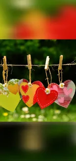 Colorful hearts hanging in nature setting.