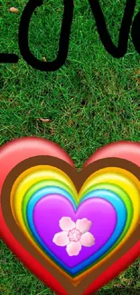 Colorful heart with love text on green grass wallpaper.