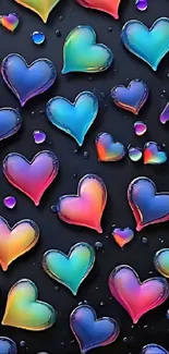 Vibrant pattern of glossy colorful hearts on a dark background.