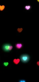 Colorful glowing hearts on a black wallpaper background.