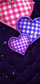 A vibrant checkered heart pattern on a dark purple textured background.