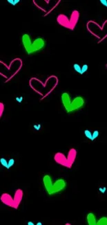 Neon hearts pattern on a black wallpaper.