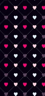 Colorful heart pattern wallpaper with pink, red, and purple hearts on black background.