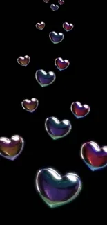 Floating colorful hearts on black background wallpaper.