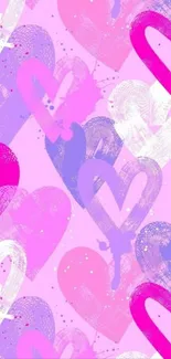 Colorful hearts pattern wallpaper in pink hues.