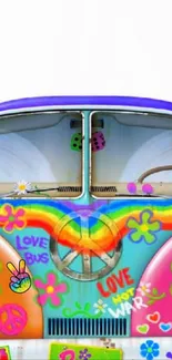 Colorful hippie van with psychedelic art and peace symbols.