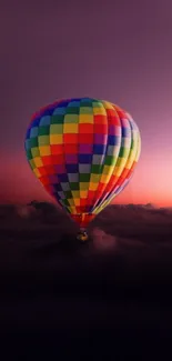 Colorful hot air balloon against twilight sky.