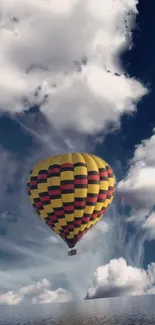 Vibrant hot air balloon against a dramatic cloudy sky.