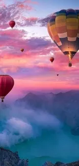 Vibrant hot air balloons float over misty mountains at sunset.