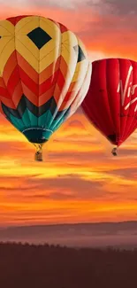 Two vibrant hot air balloons float against a sunset sky.