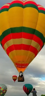 A vibrant view of colorful hot air balloons floating in the sky.