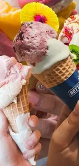 Multiple hands holding colorful ice cream cones with various flavors.