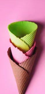 Colorful ice cream cones on pink background.