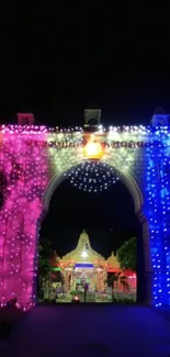 Illuminated archway with colorful lights, featuring vibrant pink and blue hues.