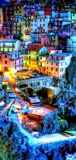 Vibrant Italian coastal village at night with colorful houses.