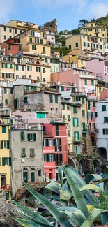 Colorful hillside village with pastel buildings in Italy.