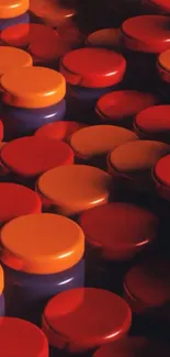 Vibrant pattern of red and orange jar caps.