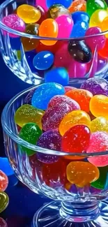 Colorful jelly beans in crystal bowls against a dark background.