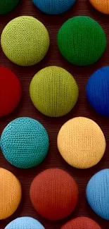 Vibrant wallpaper with colorful knitted circles.