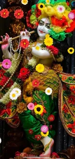 Vibrant Krishna statue with colorful attire and decor.