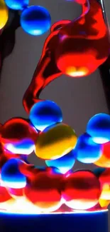 A vibrant lava lamp with colorful red, blue, and yellow swirls.