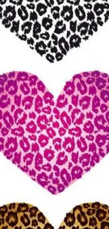 Three leopard print hearts in black, pink, and gold on white background.