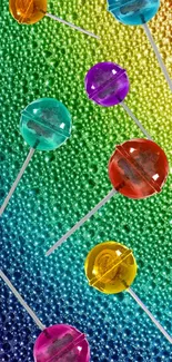 Colorful lollipops on a rainbow textured background.