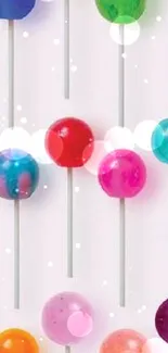 Colorful lollipops arranged in a playful pattern on a white background.