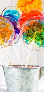 A bucket with vibrant, colorful lollipops on display.