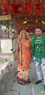 Couple standing under love sign with confetti.