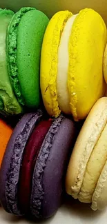 Colorful macarons in a vibrant arrangement as a phone wallpaper.