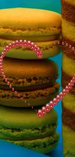 Vibrant macaron stack with jeweled heart overlay.