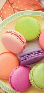 A vibrant mobile wallpaper of colorful macarons.