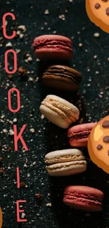 Artistic wallpaper with colorful macarons and cookie graphics on dark background.