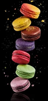 Colorful macarons stacked on sleek black background, vibrant and sweet design.