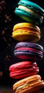 A vibrant stack of colorful macarons against a black background.