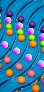 A vibrant cascade of colorful marbles on a blue background.