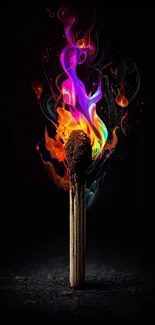 Colorful flames engulf a matchstick against a dark background.