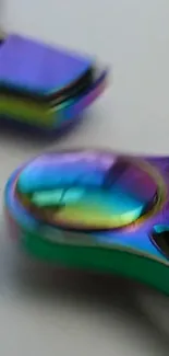 Colorful metallic fidget spinner with iridescent hues.