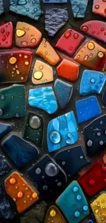 Colorful mosaic of various stones with water droplets, forming an abstract pattern.