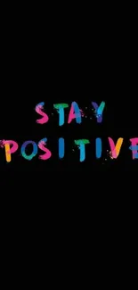 Colorful 'Stay Positive' text on black background wallpaper.