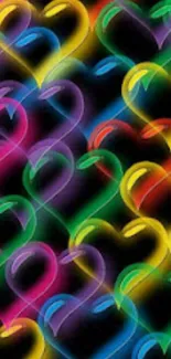 Vibrant neon heart pattern with colorful glow on a black background.