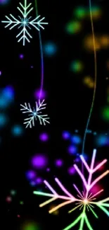 Colorful neon snowflakes on a dark wallpaper background.