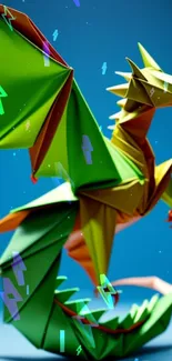 Vibrant origami dragon in green, orange, and yellow hues on blue backdrop.