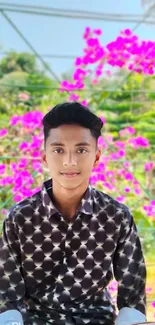 Young person in floral garden with colorful flowers.