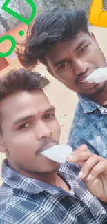 Two friends enjoying ice cream outdoors with colorful graphics.