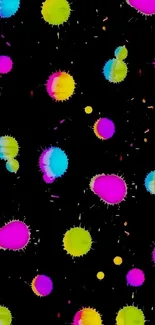 Bright, colorful paint splatter on a black background wallpaper.