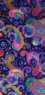 Vibrant paisley pattern with colorful floral elements on dark blue background.