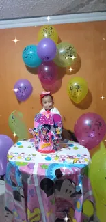 Decorative birthday scene with balloons and cake.