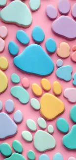 Colorful paw print pattern on pink background.